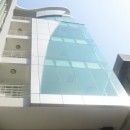 Doanh nghiệp nên đặt trụ sở văn phòng làm việc trong cao ốc hay nhà phố?